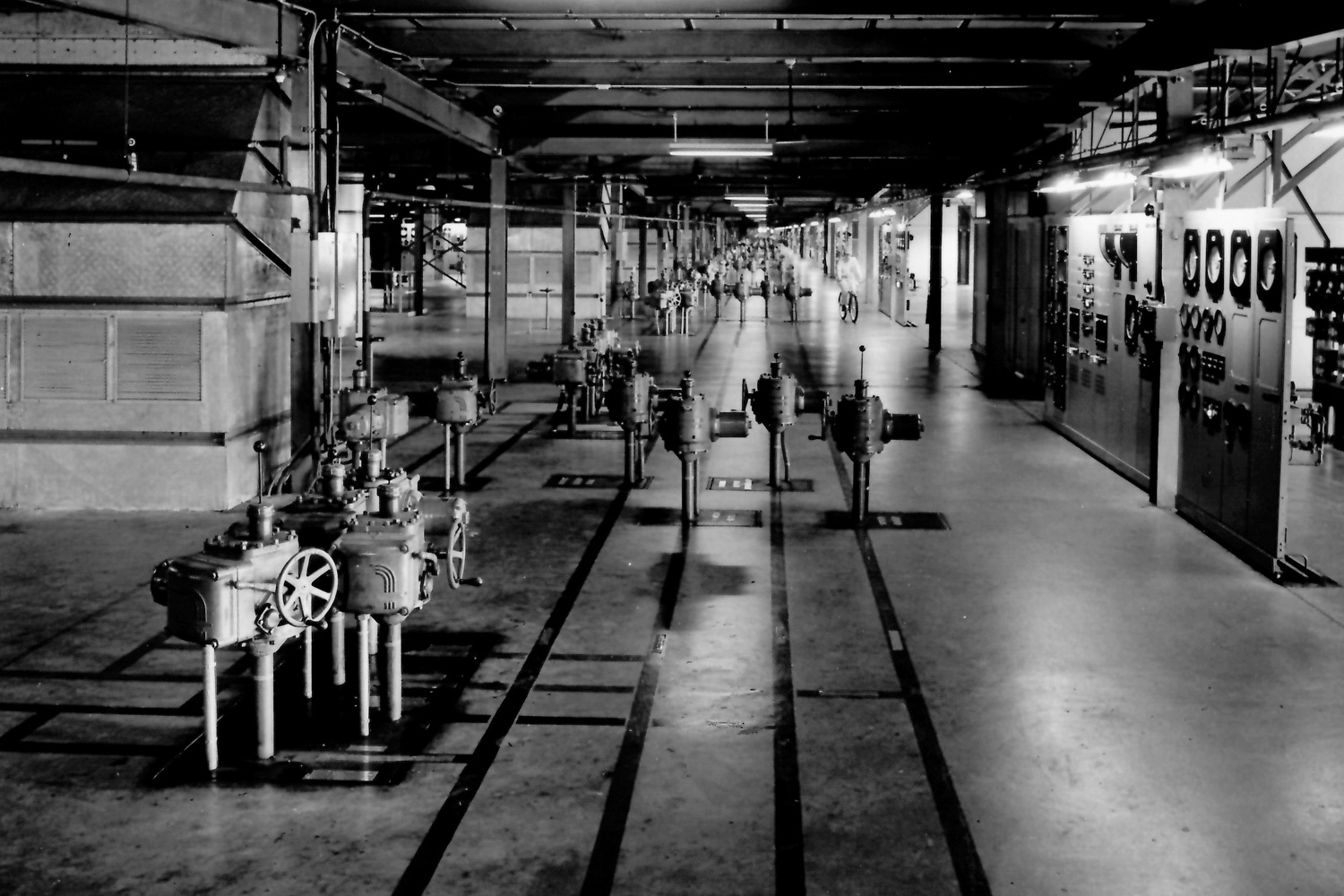 K-25 Operating Floor with Operator riding bicycle in the background